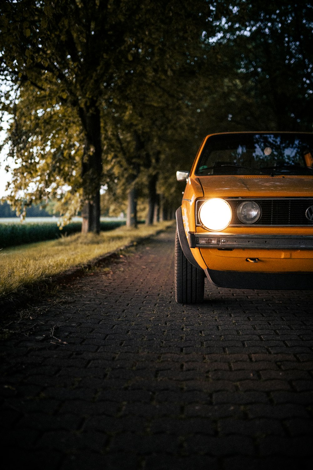 yellow car on road during daytime