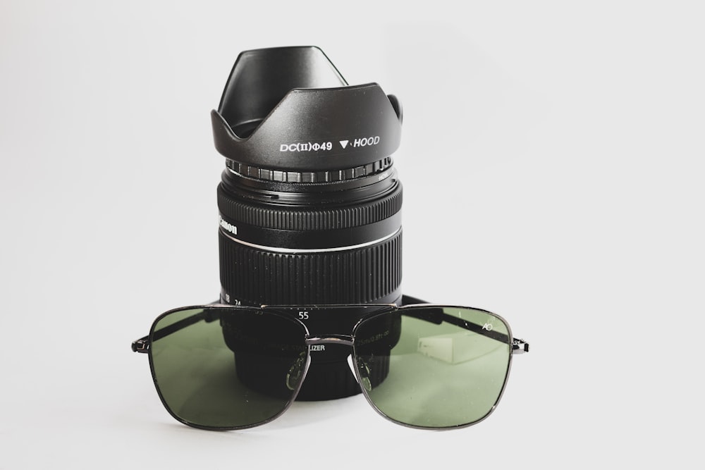 black framed green lens sunglasses
