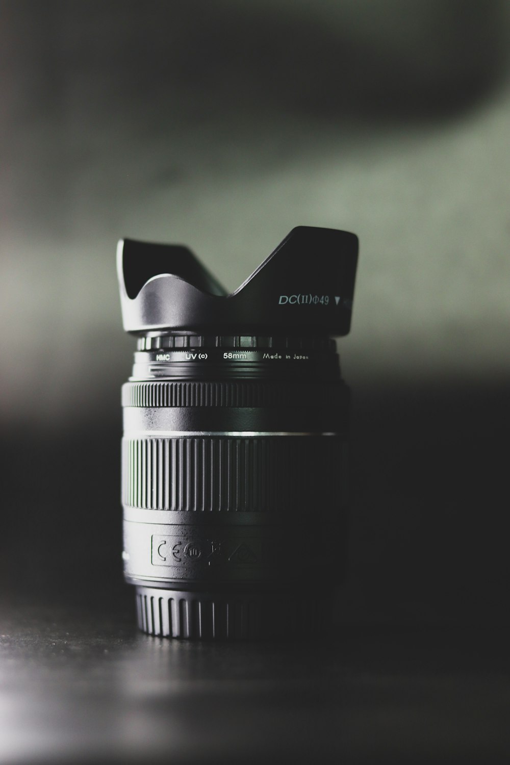 black camera lens on brown wooden table