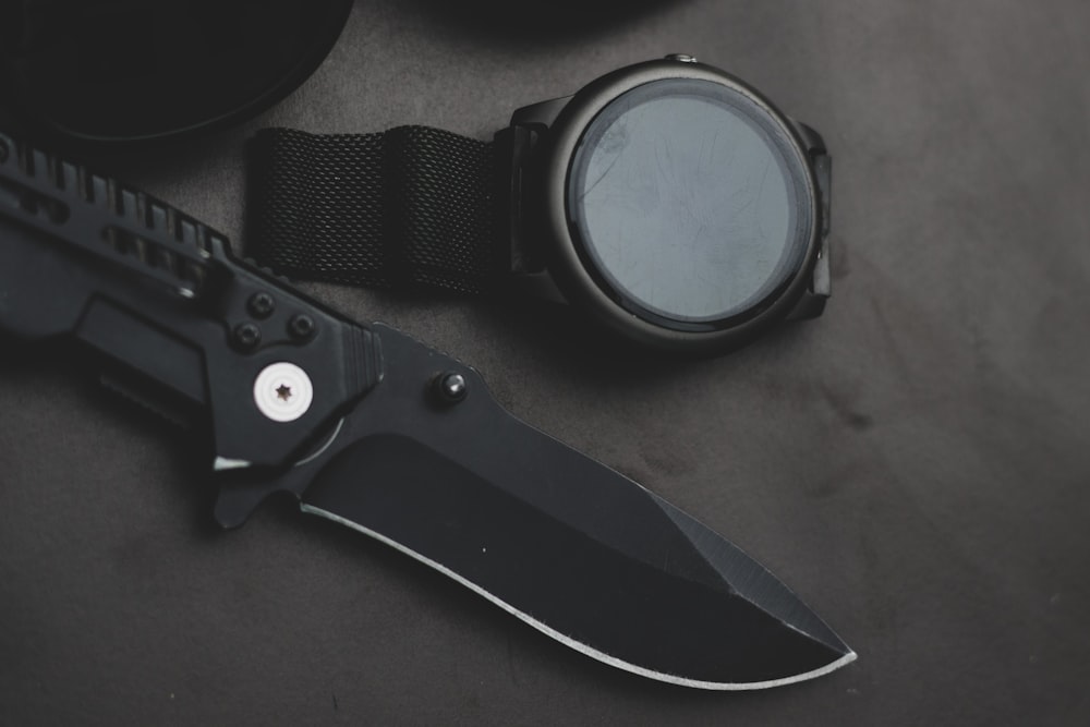 black and silver scissors on brown wooden table