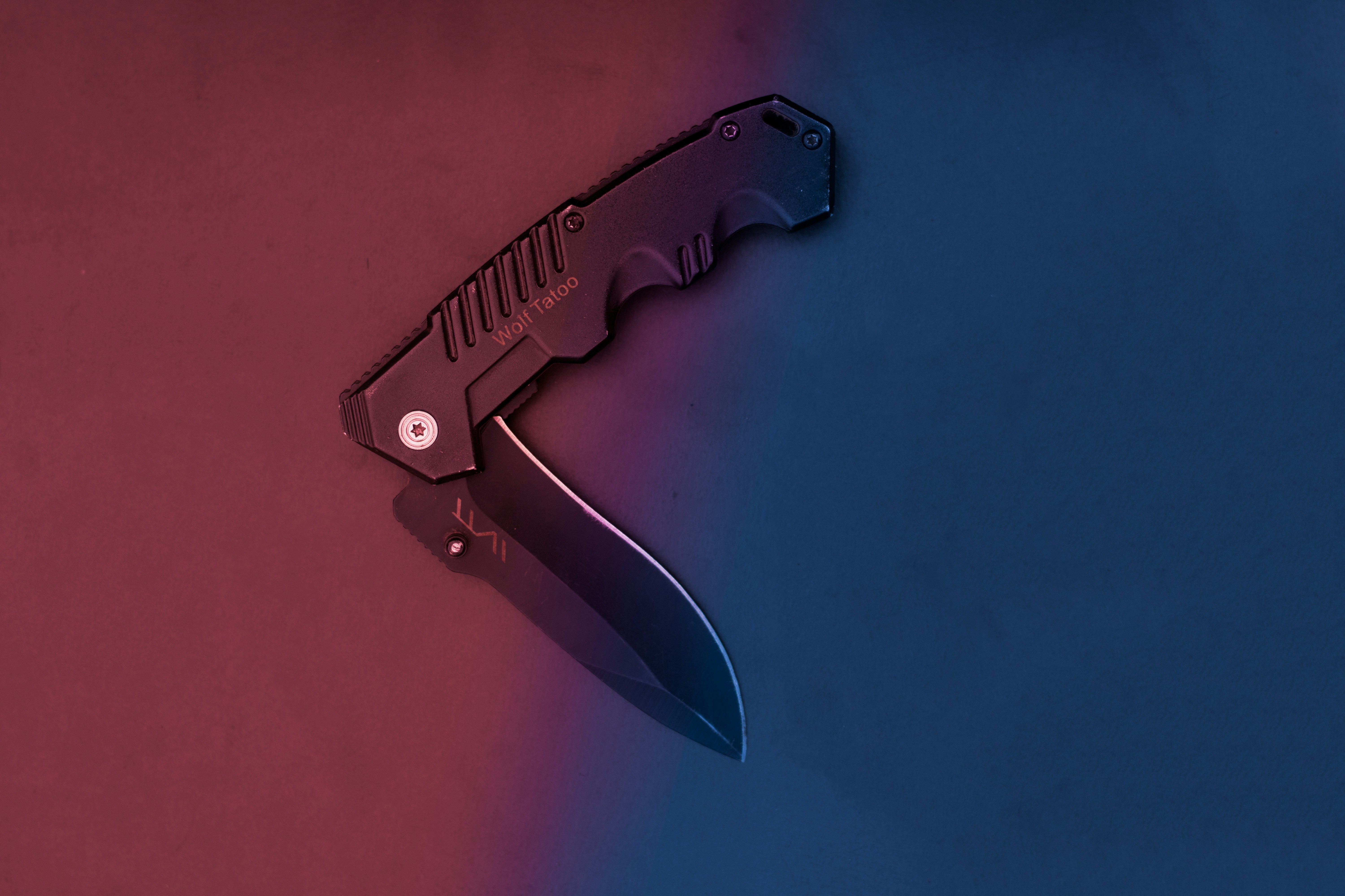 black and silver folding knife