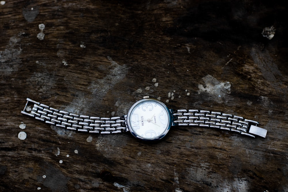 silver and white analog watch