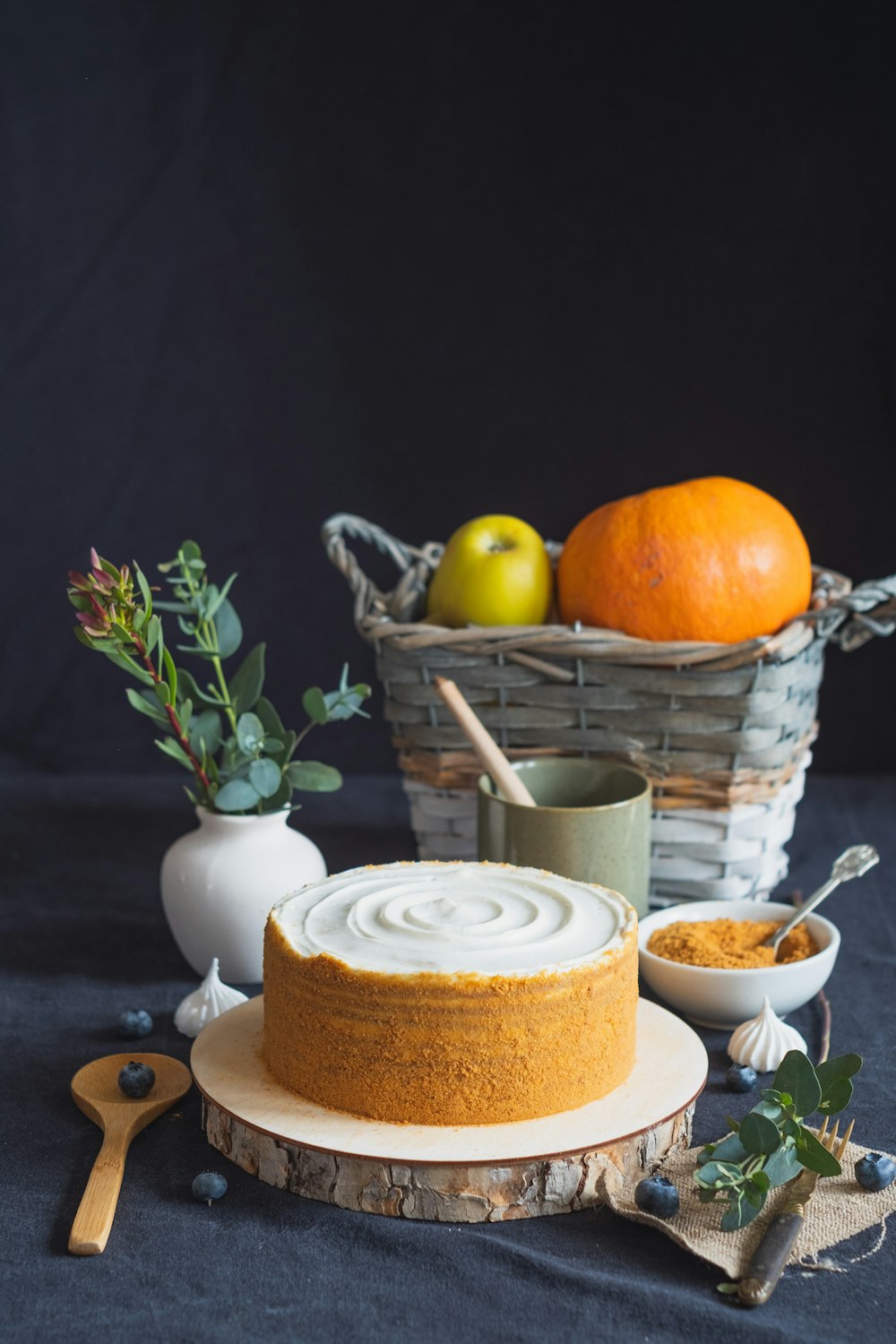 orange fruit on white ceramic plate beside white ceramic cup with saucer