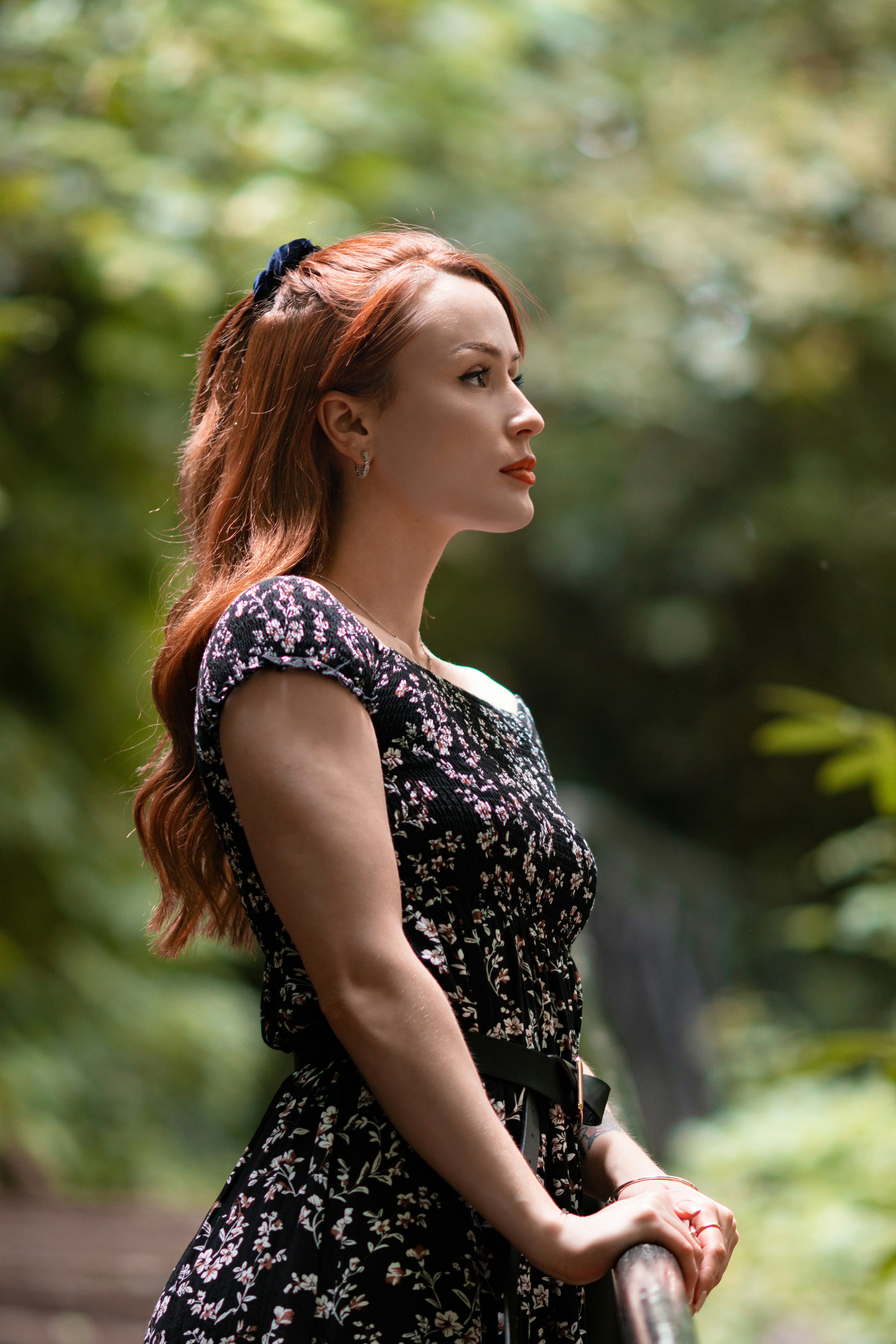 woman in black and white floral sleeveless dress