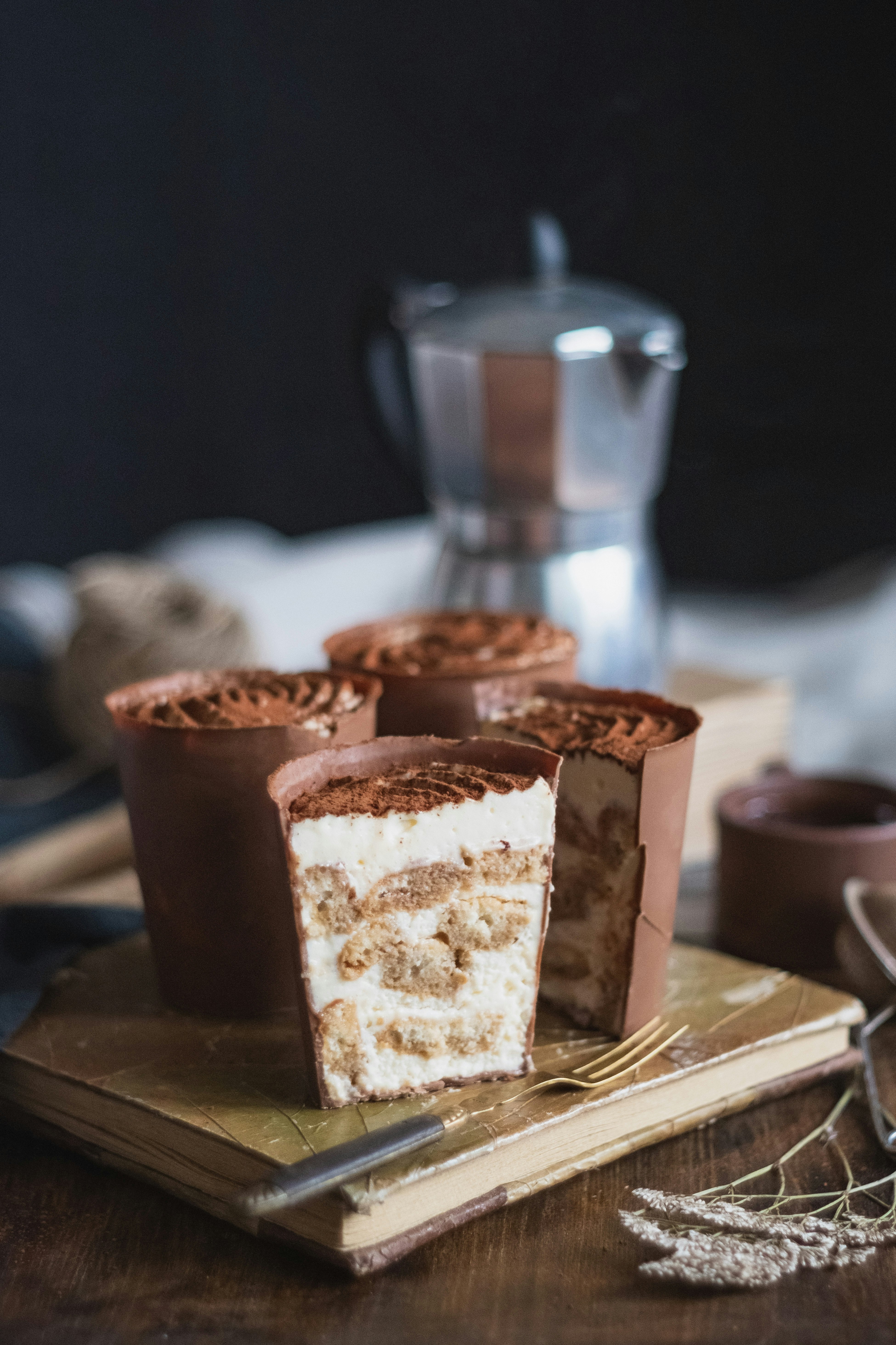 brown and white chocolate cupcakes on white ceramic plate