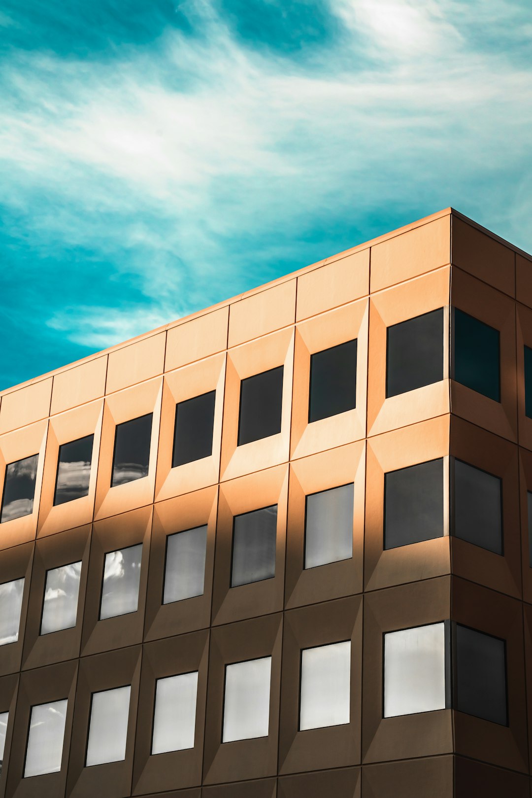 brown concrete building under blue sky during daytime