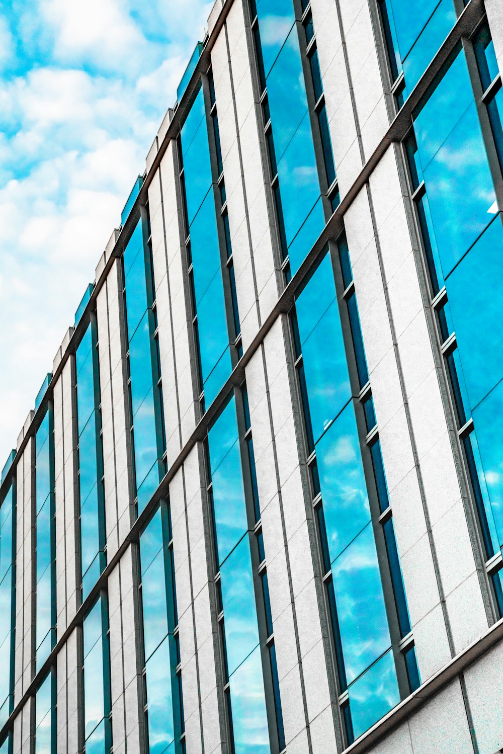 white and blue concrete building under blue sky during daytime