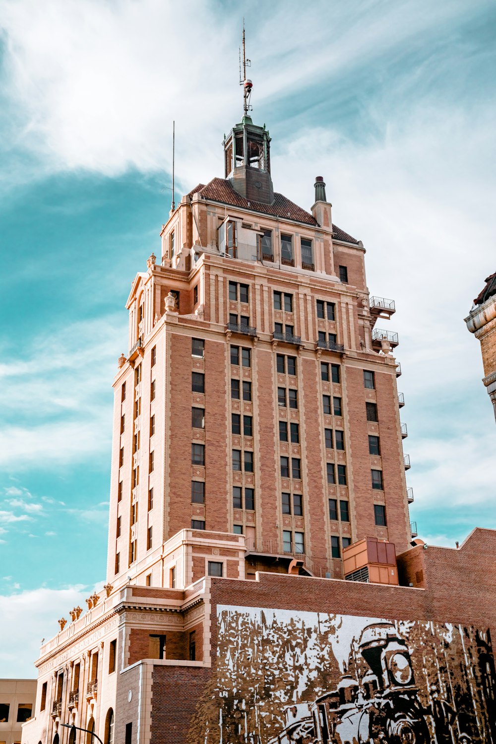 brown concrete building under blue sky during daytime