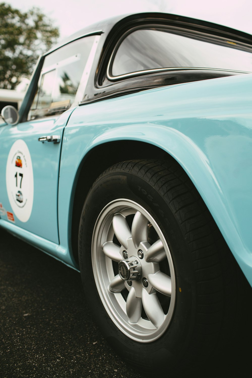 blue and silver car with chrome wheel