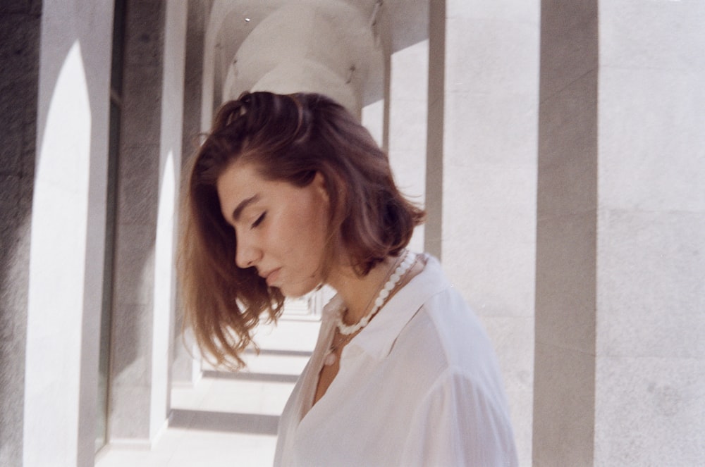 woman in white button up shirt