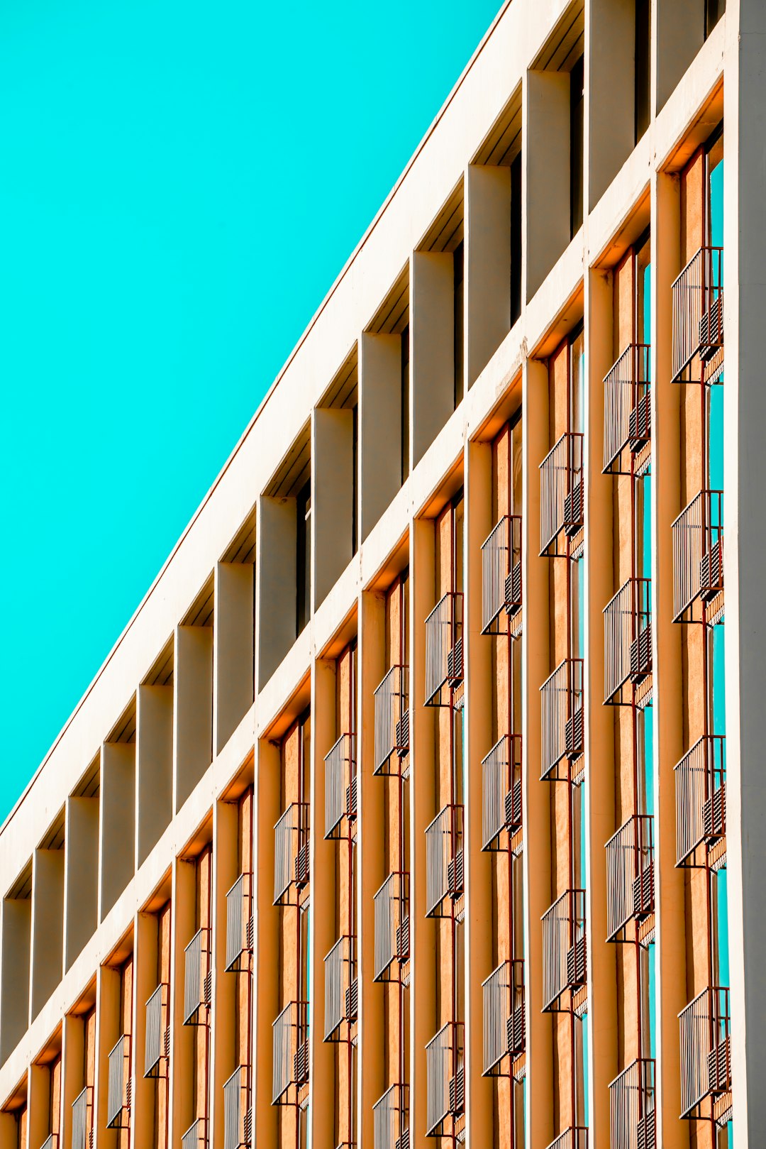 white and brown concrete building under blue sky during daytime