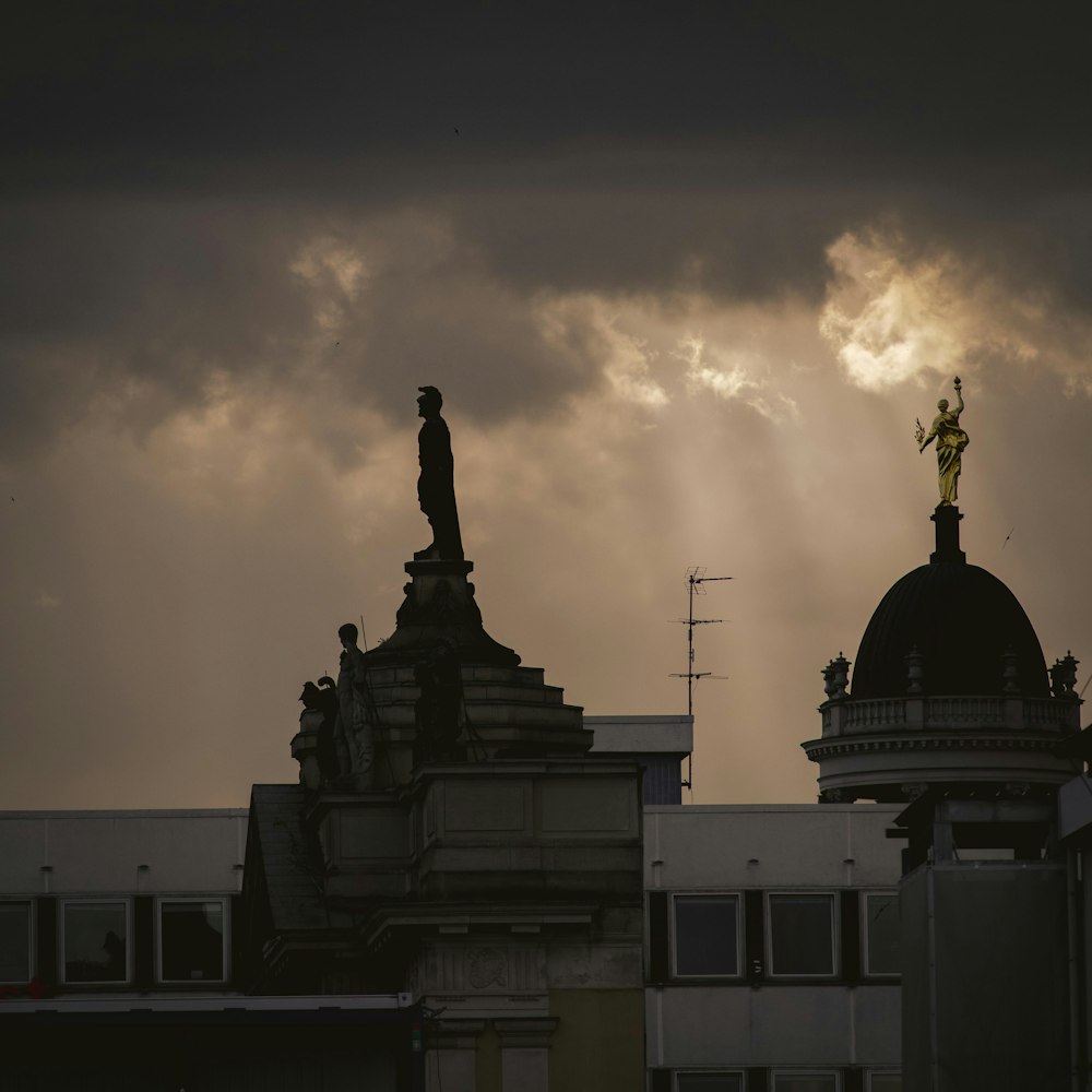 a building with a statue on top of it