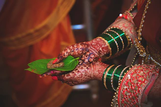 red and green leaf on brown wooden table