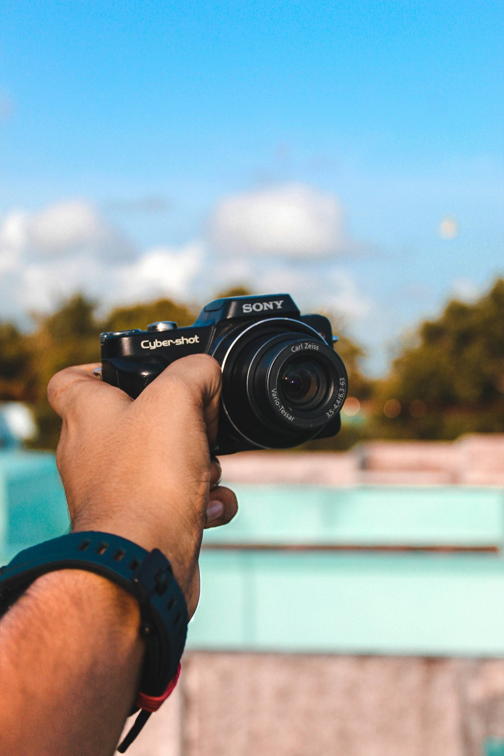 person holding black nikon dslr camera