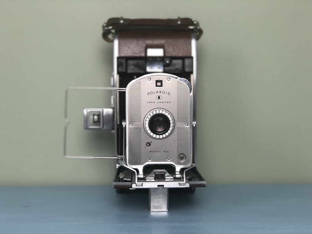 black and silver polaroid camera