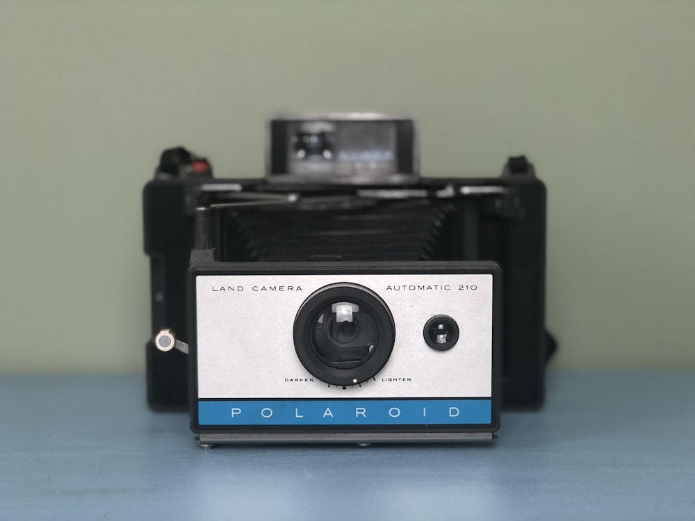 black and silver polaroid camera
