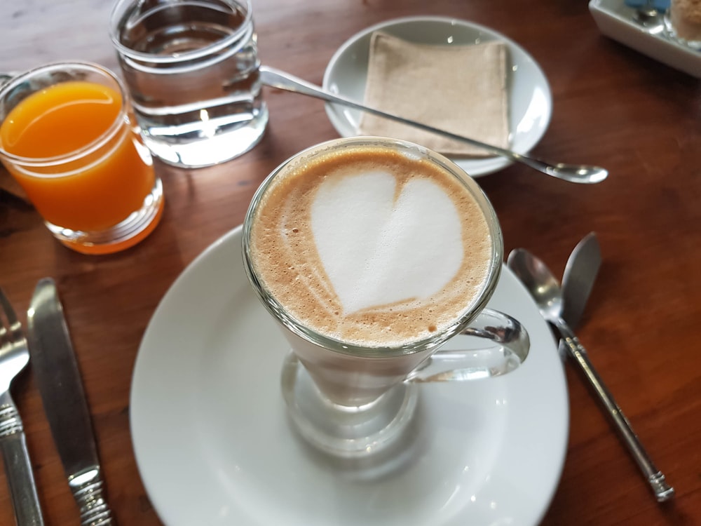 white ceramic cup with cappuccino