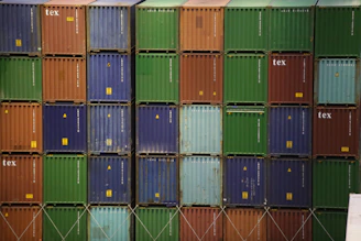 Stacked 8-foot containers used for compact living or office space with visible ventilation panels.