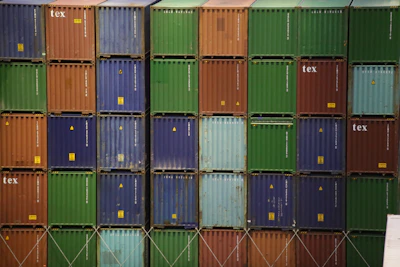 Close-up of stacked colorful shipping containers ready for transport.