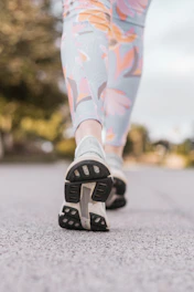 Athlete wearing breathable leggings while jogging outdoors.