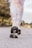 Close-up of a healthcare professional assessing a patient's walking pattern in a clinical setting.