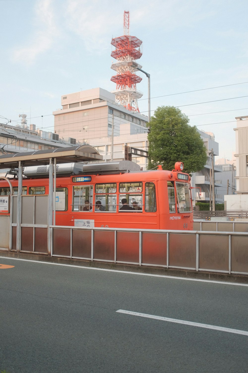 red and white train on rail road during daytime