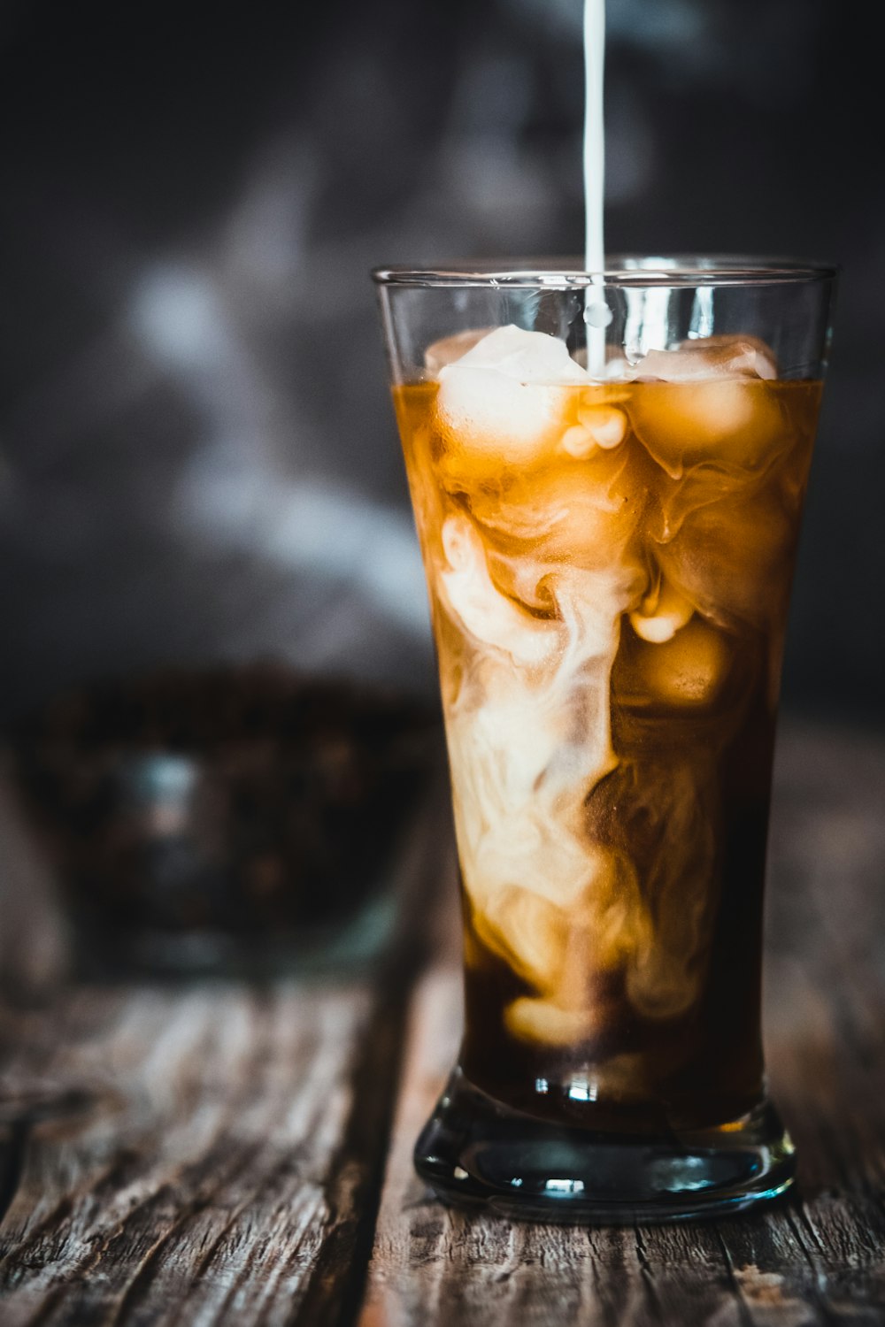 clear drinking glass with ice and ice