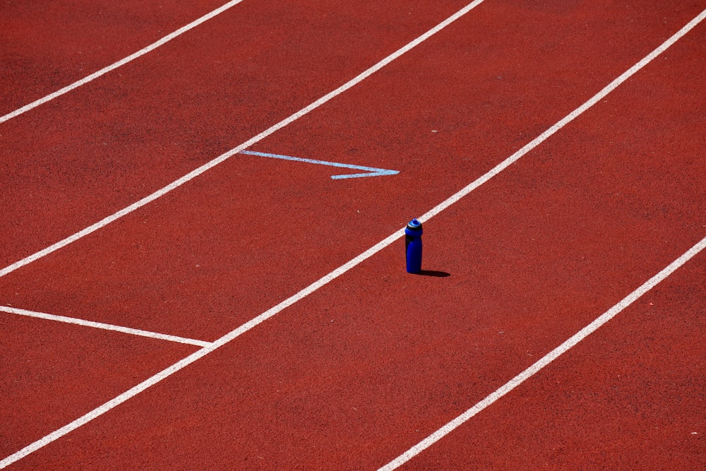 blue thread on brown and white track field