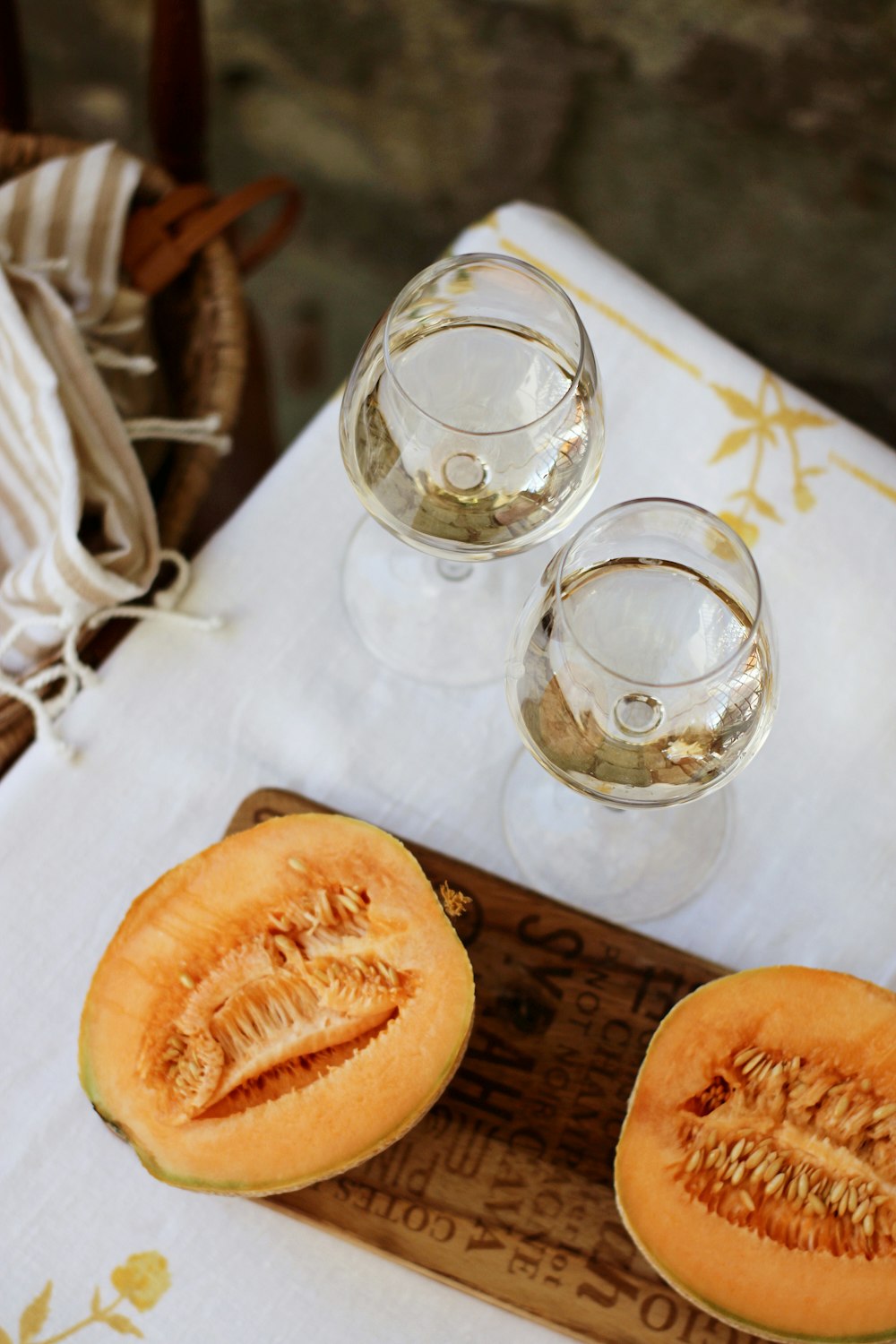 clear drinking glass beside sliced orange fruit