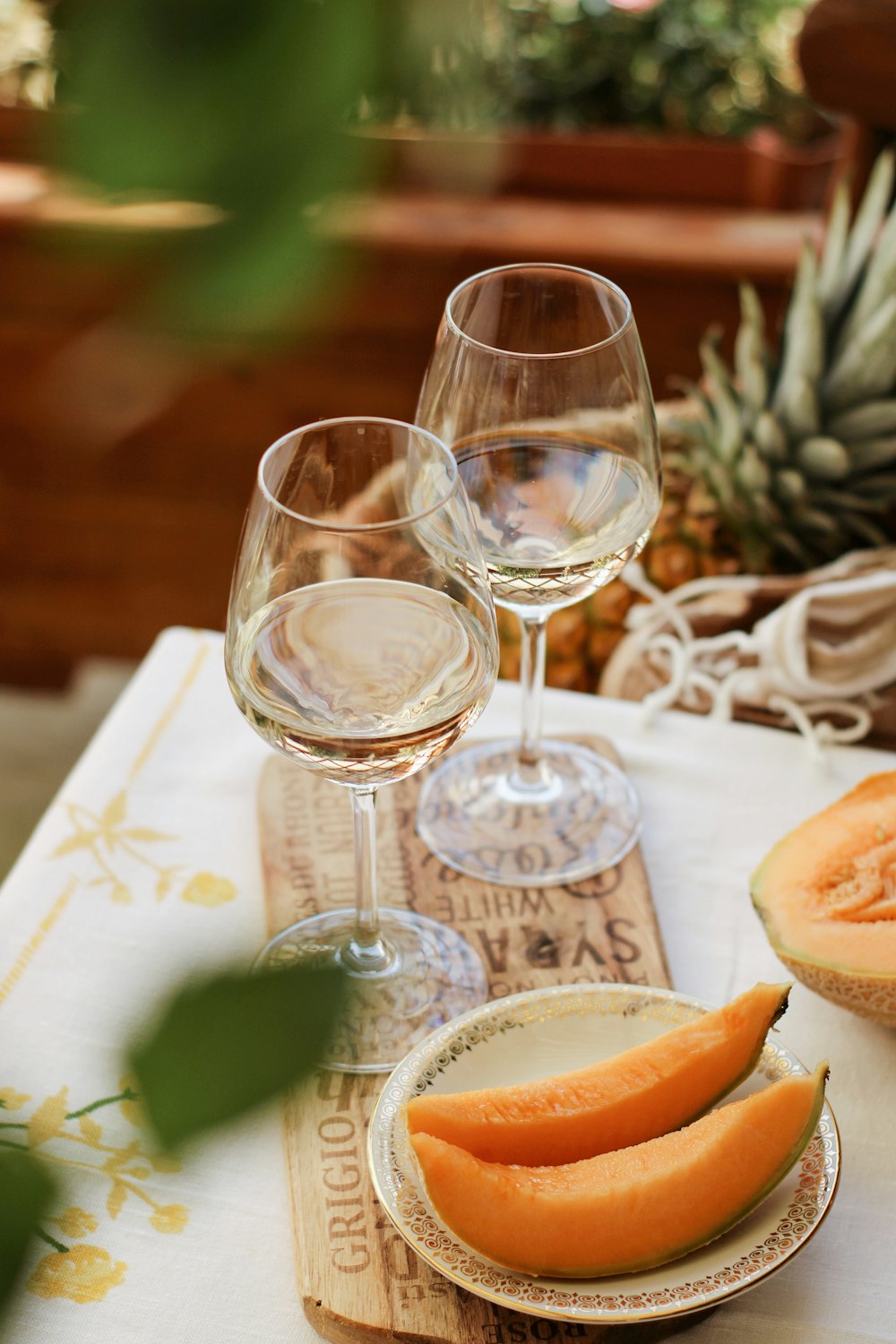 clear wine glass on white table cloth