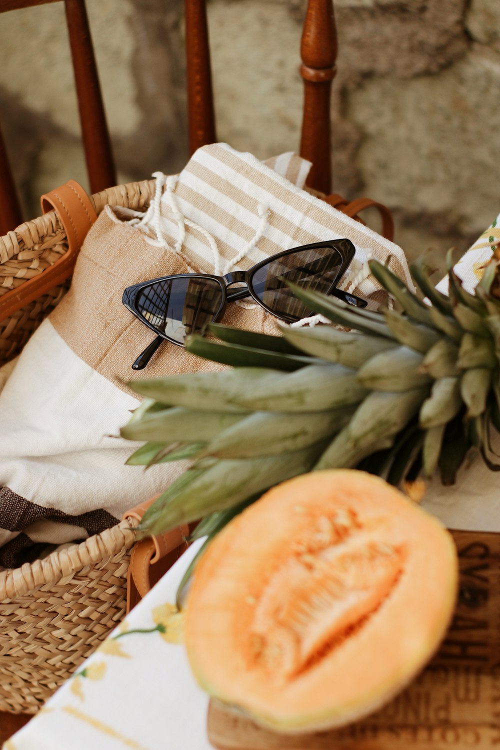 black framed sunglasses on brown woven basket