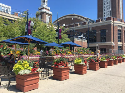 Beautiful garden terrace with outdoor seating and flowering plants.