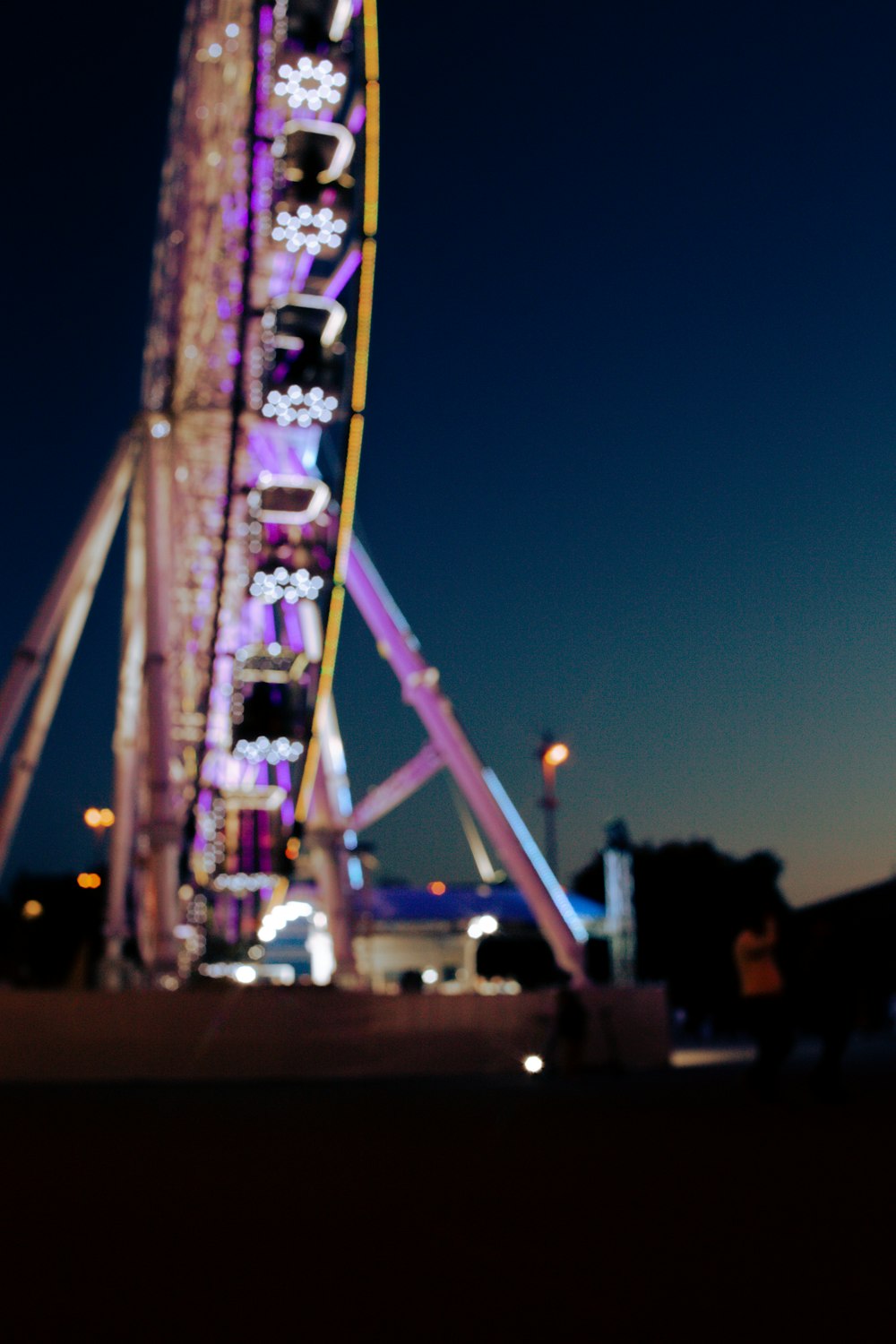 purple and pink lighted tower during night time