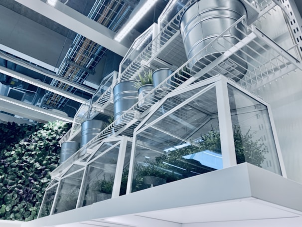 Close-up of a retro metal file rack styled with outdoor gear and plants