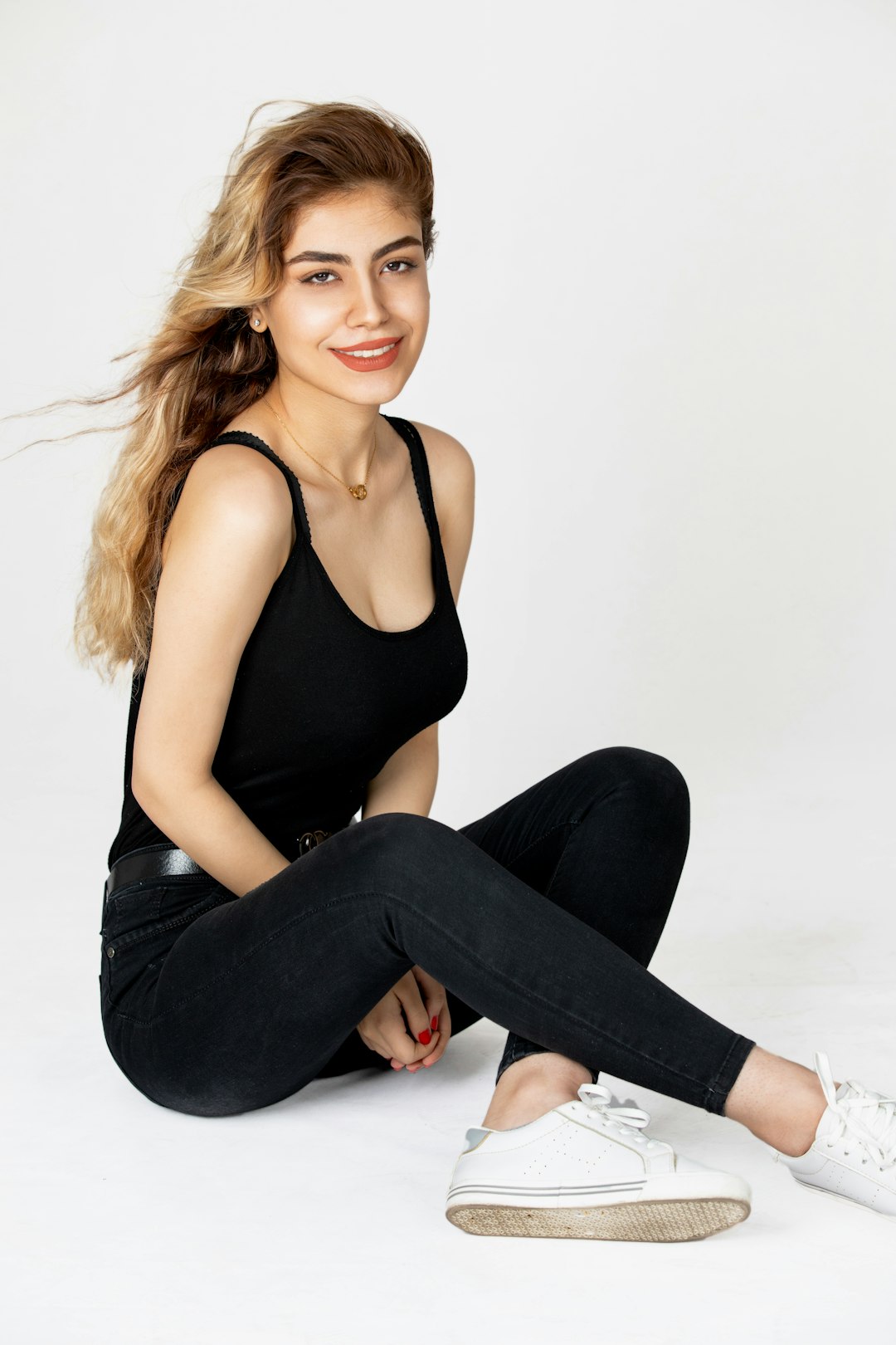 woman in black tank top and black denim jeans