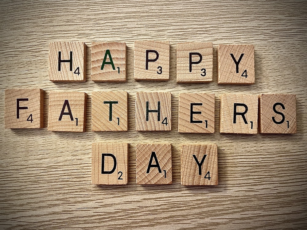 brown wooden letters spelling Happy Father's Day