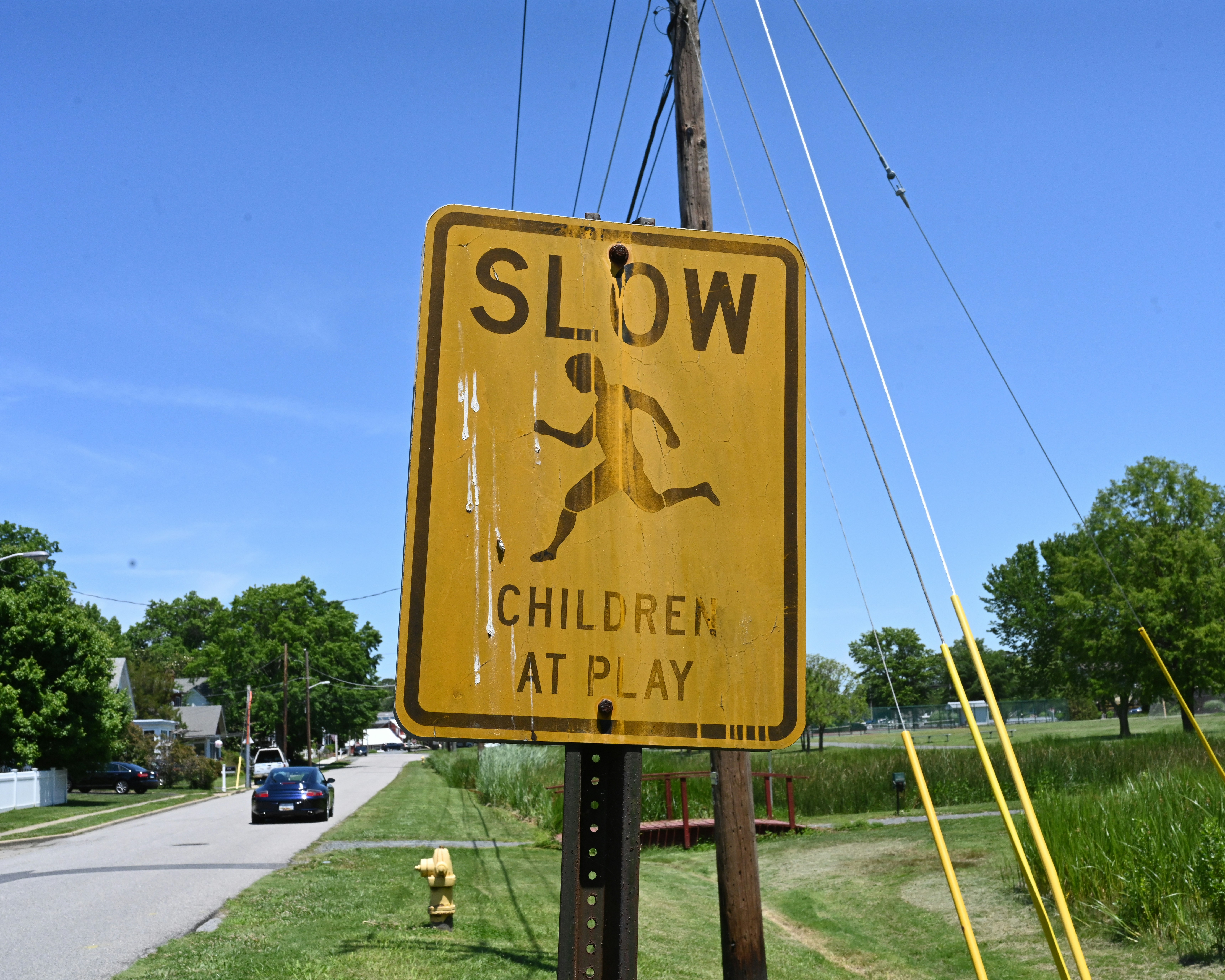 Oxford, Maryland, 06/18/2021. A weathered and fouled children at play sign in Oxford, Maryland