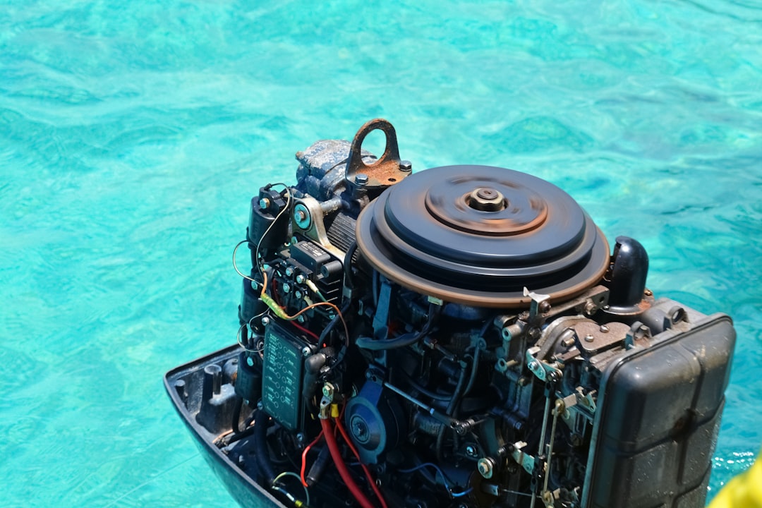 black and red metal tank on water