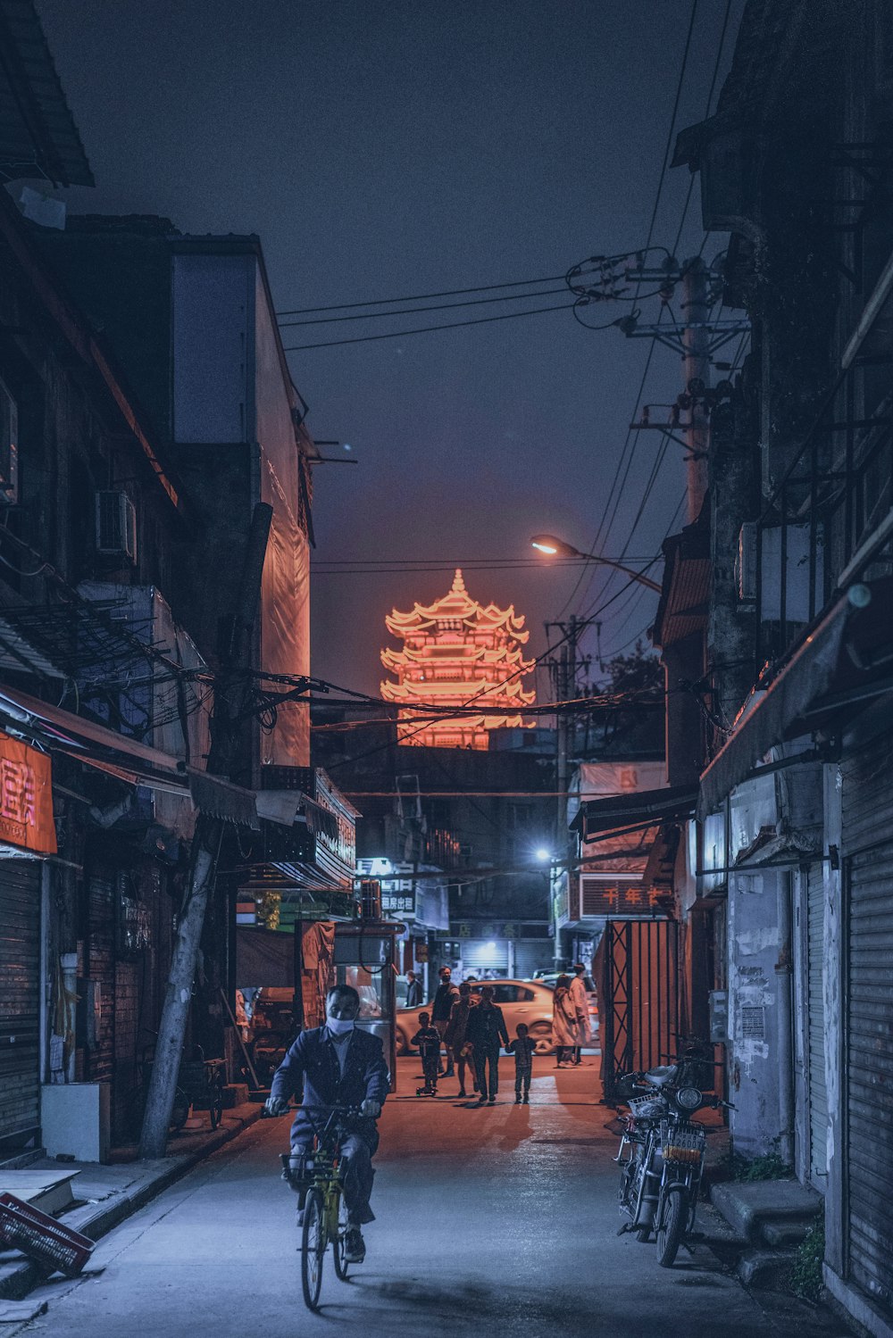 people walking on street during night time