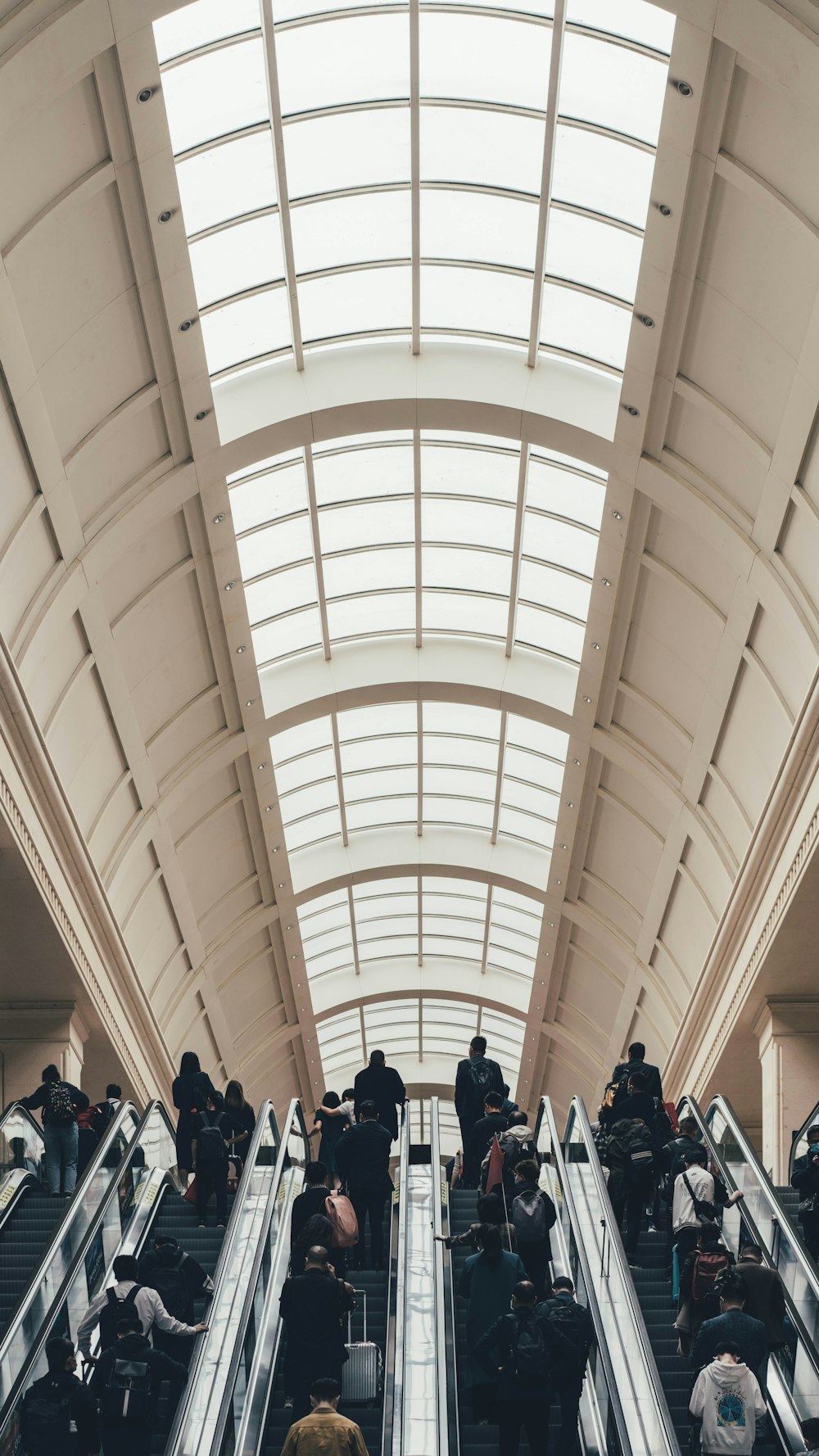 people walking inside white building