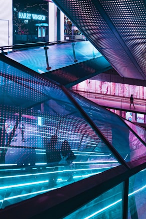 people walking on glass building