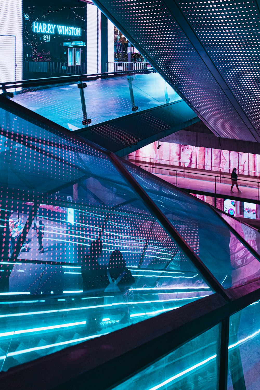 people walking on glass building