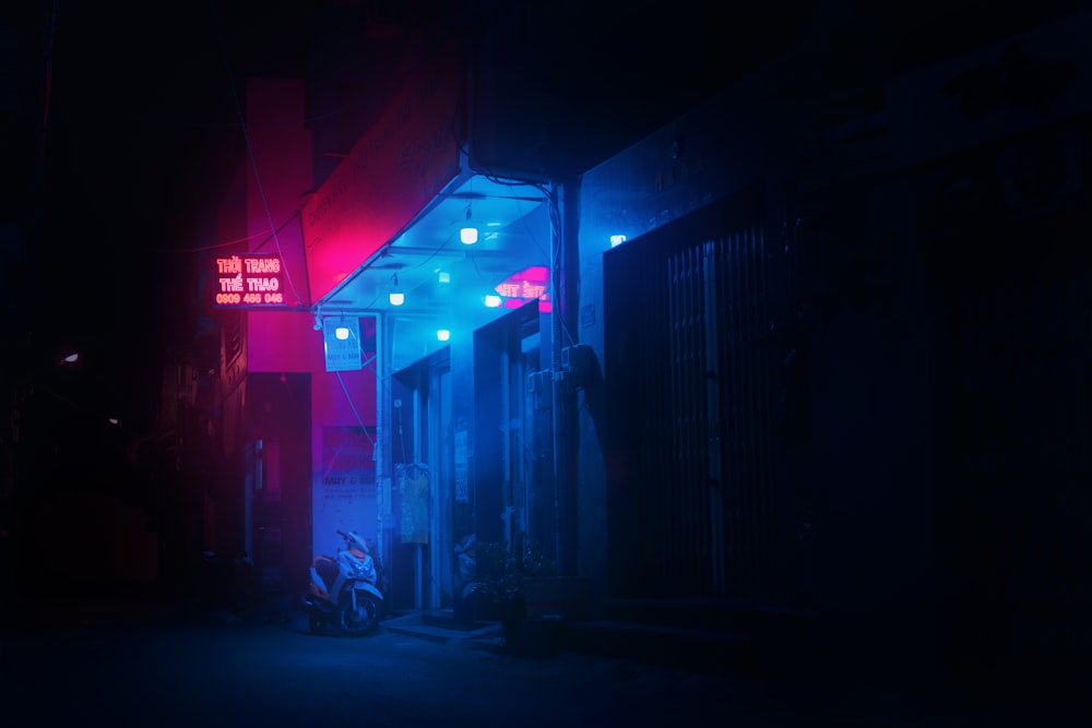 red and white store front during night time