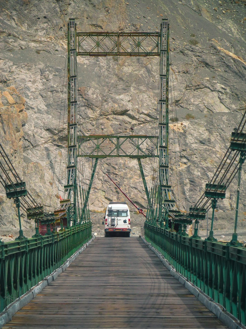 people walking on wooden bridge