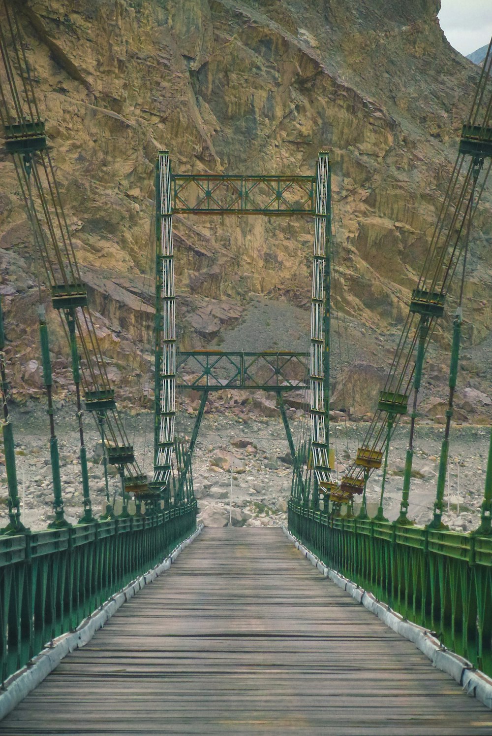 people walking on wooden bridge