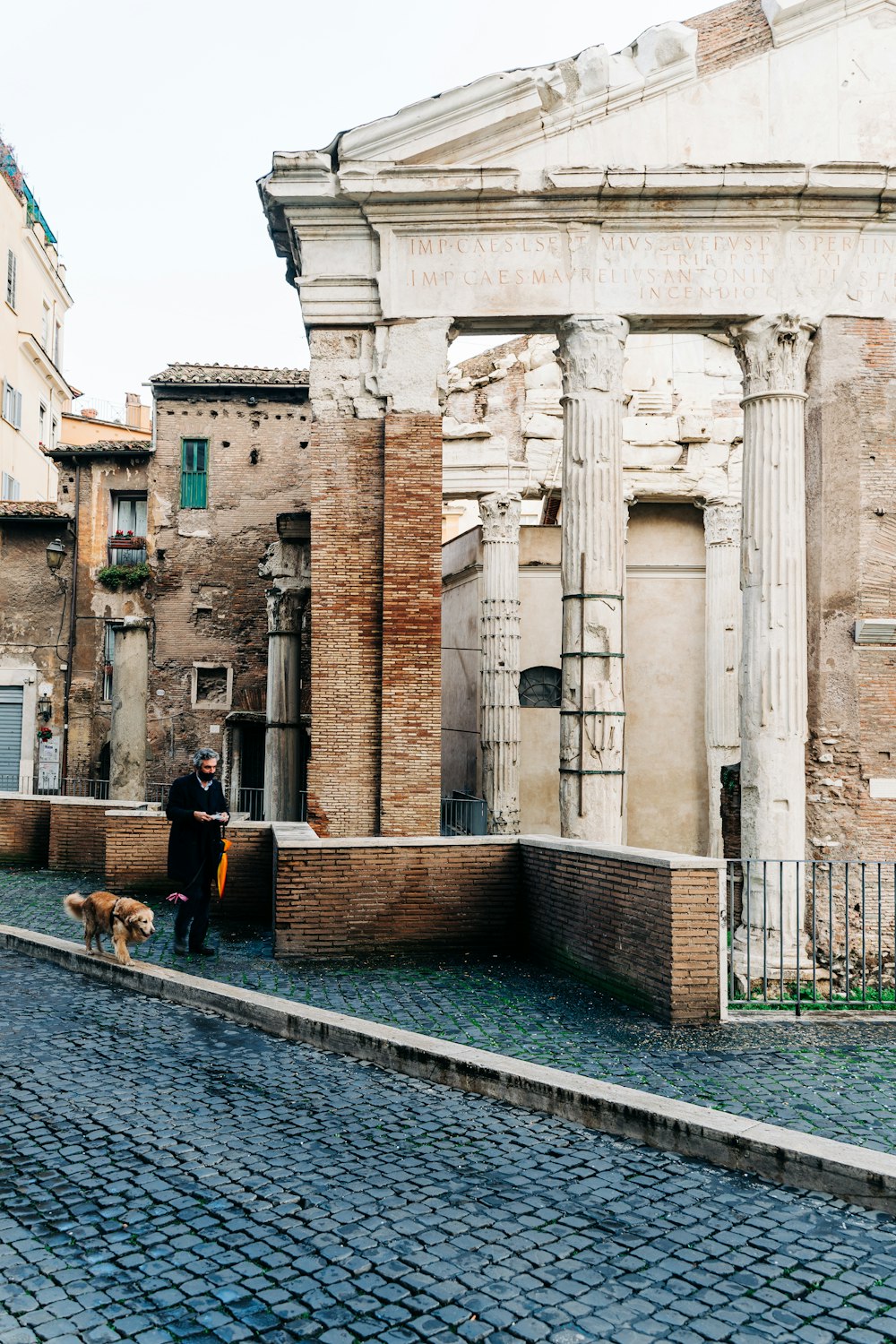 people sitting on bench near building during daytime