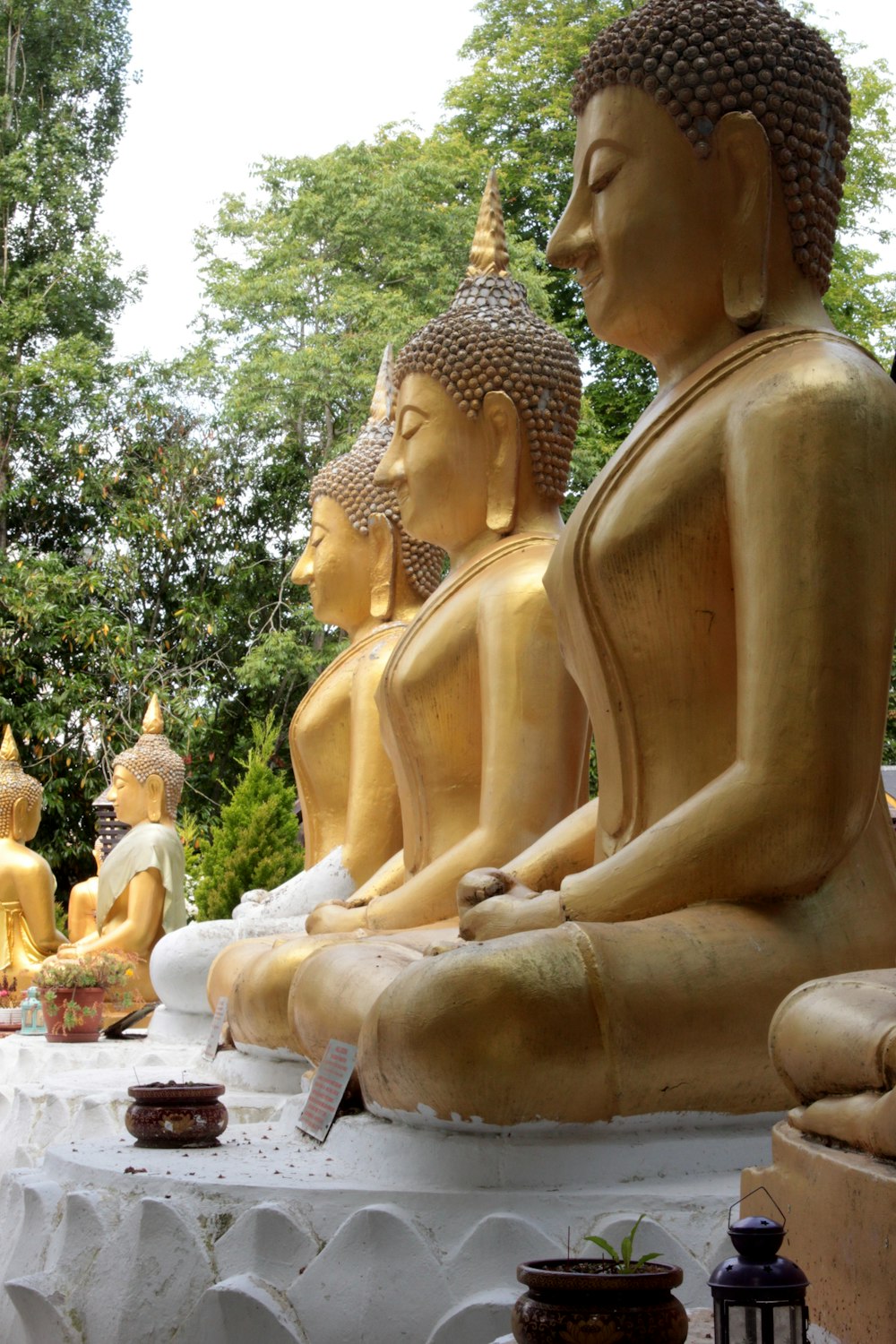 gold buddha statue during daytime