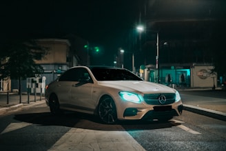silver mercedes coupe on road during night time