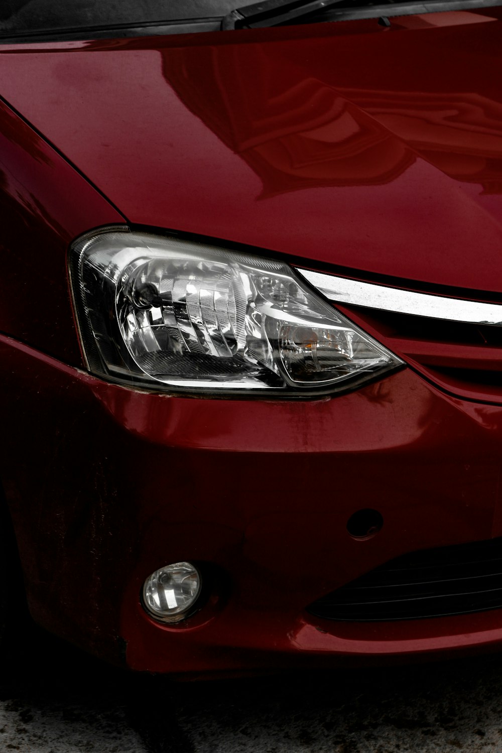 red car with silver car wheel