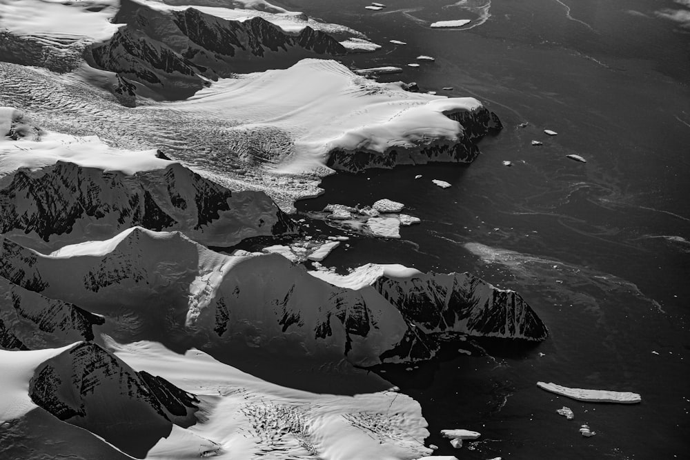 grayscale photo of snow covered mountain